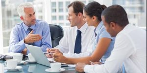 Group of business people brainstorming together in the meeting room