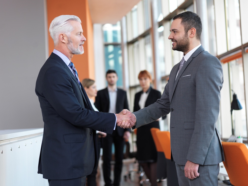 Business-partners-partnership-concept-with-two-businessman-handshake-1 - Hiring Department Managers That Are A Perfect Fit