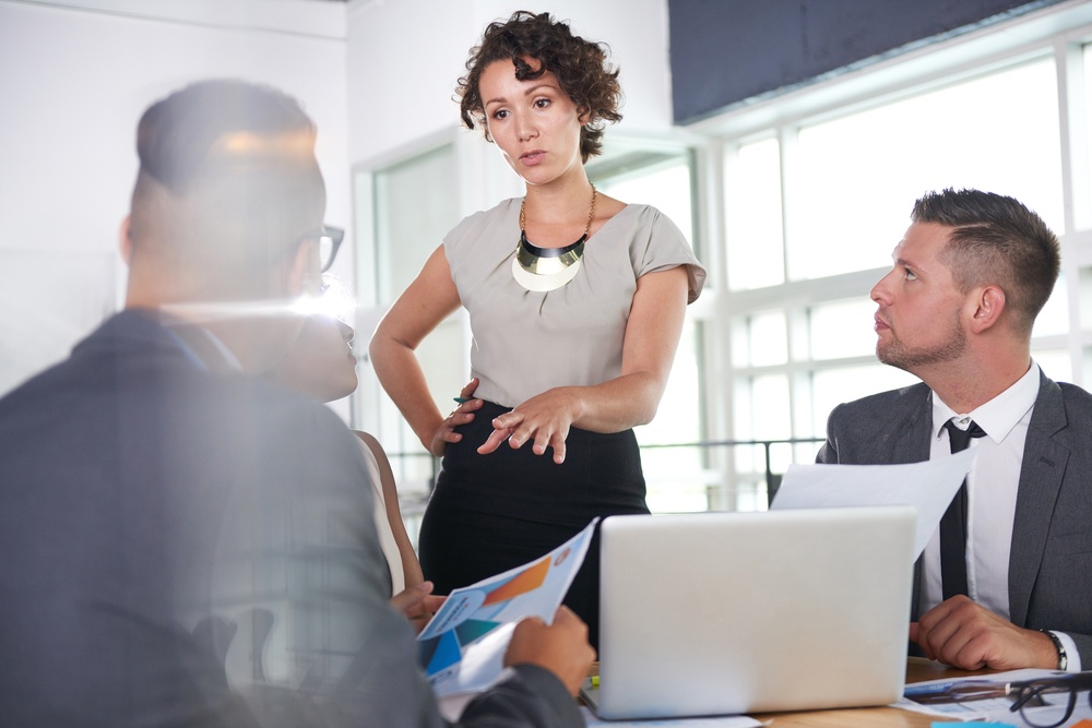 Team-of-successful-business-people-having-a-meeting-in-executive-sunlit-office-1 - The Best Gift for Executives? Feedback